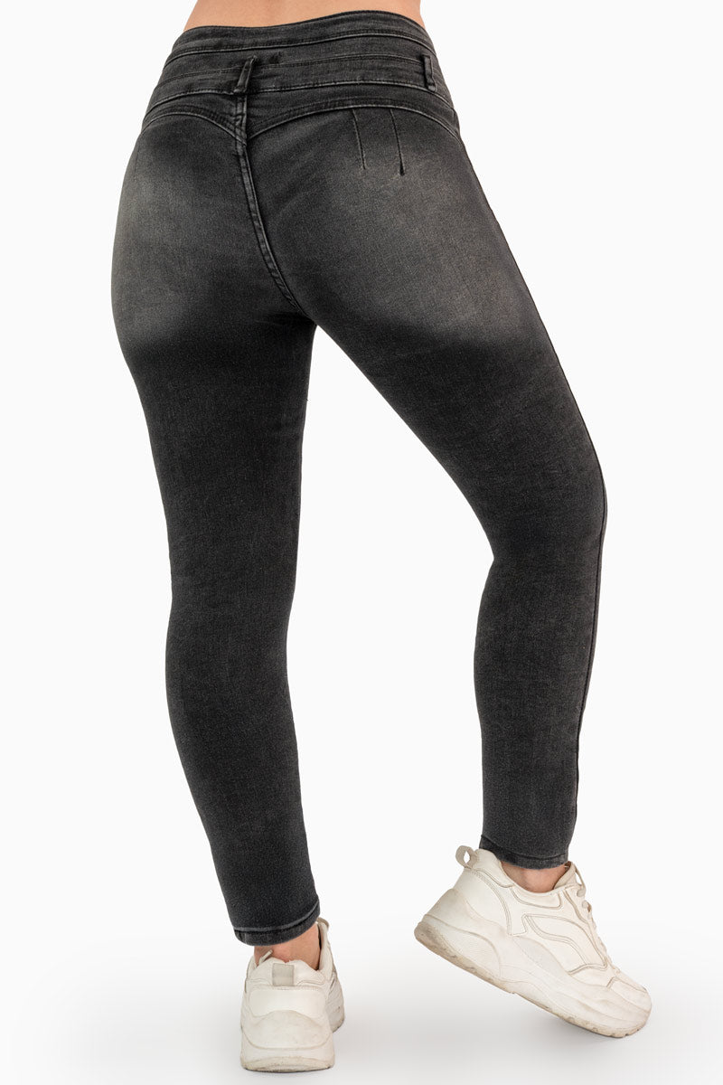 Jeans skinny tiro alto y pretina de 3 botones