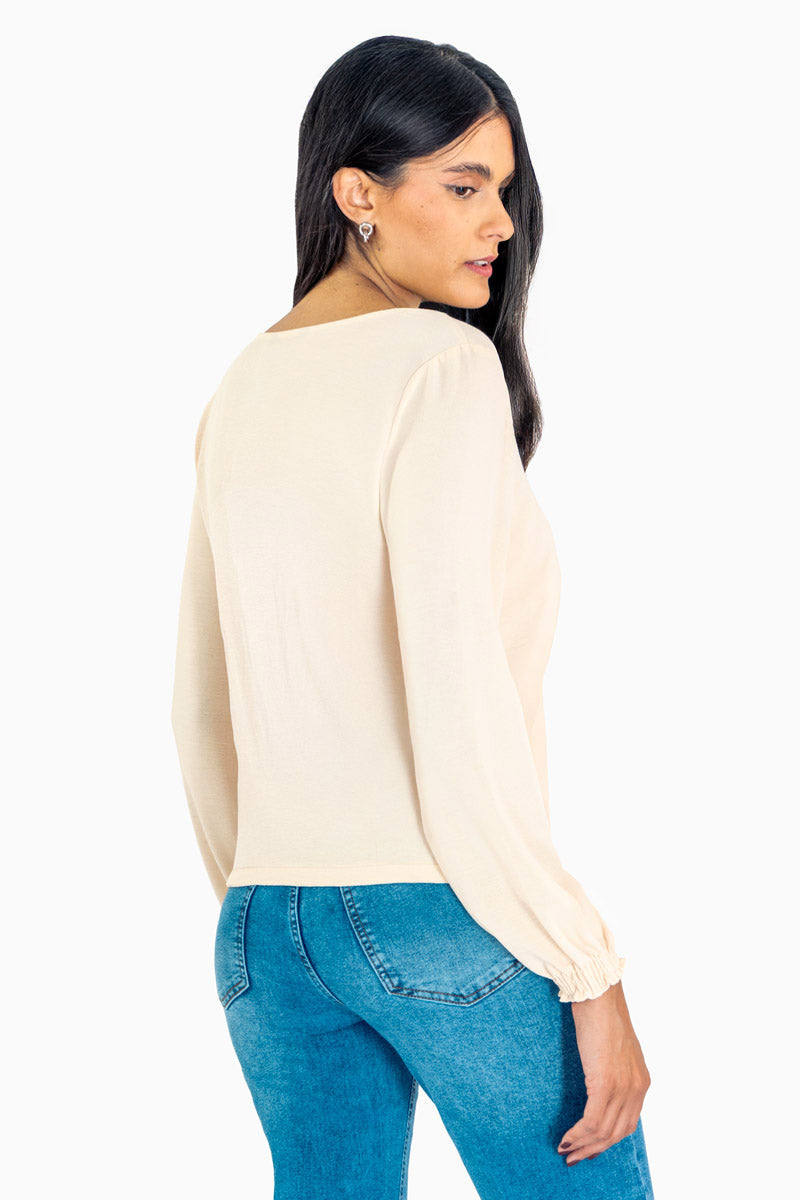 Blusa manga larga con encaje y elástico en puños