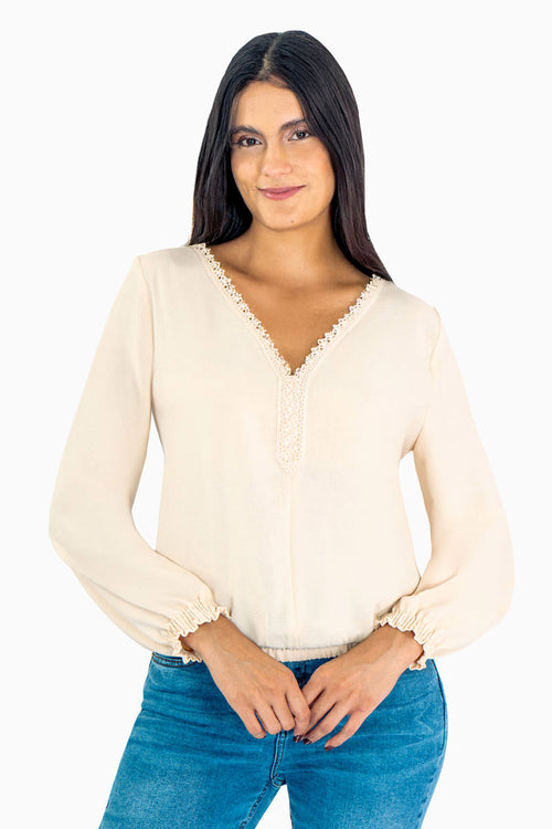 Blusa manga larga con encaje y elástico en puños