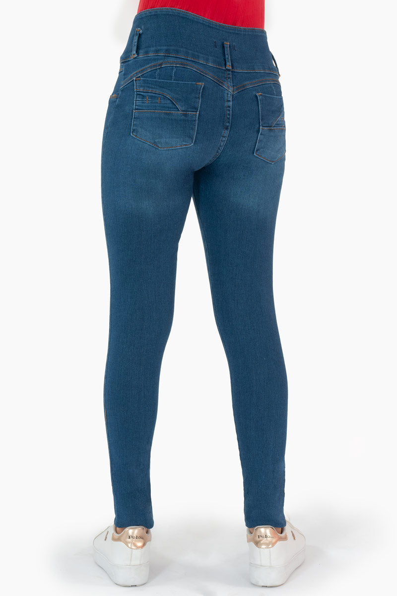 Jeans skinny con pretina ancha de 3 botones y destrucción