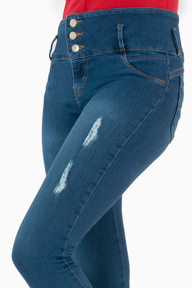 Jeans skinny con pretina ancha de 3 botones y destrucción