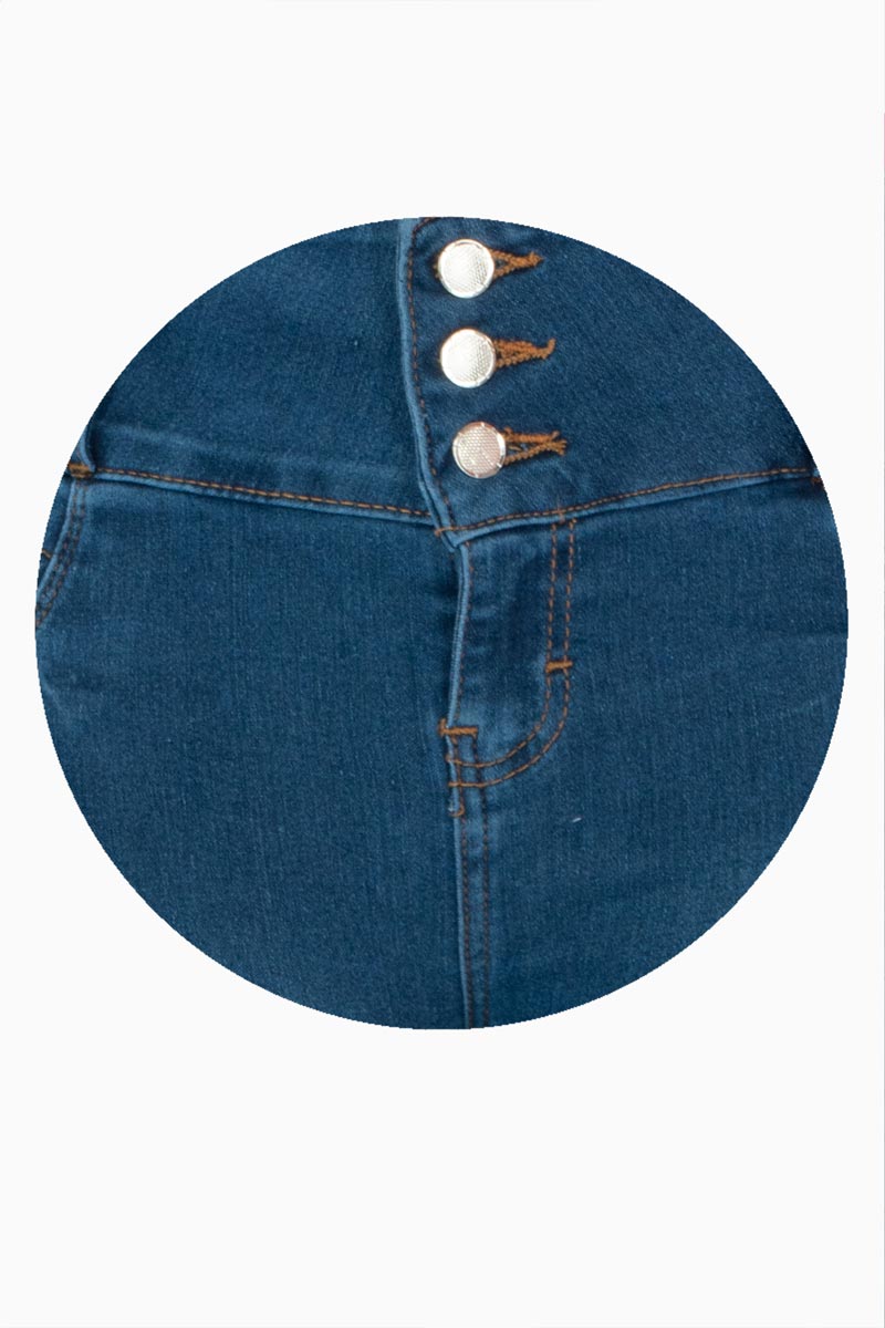 Jeans skinny con pretina ancha de 3 botones y destrucción