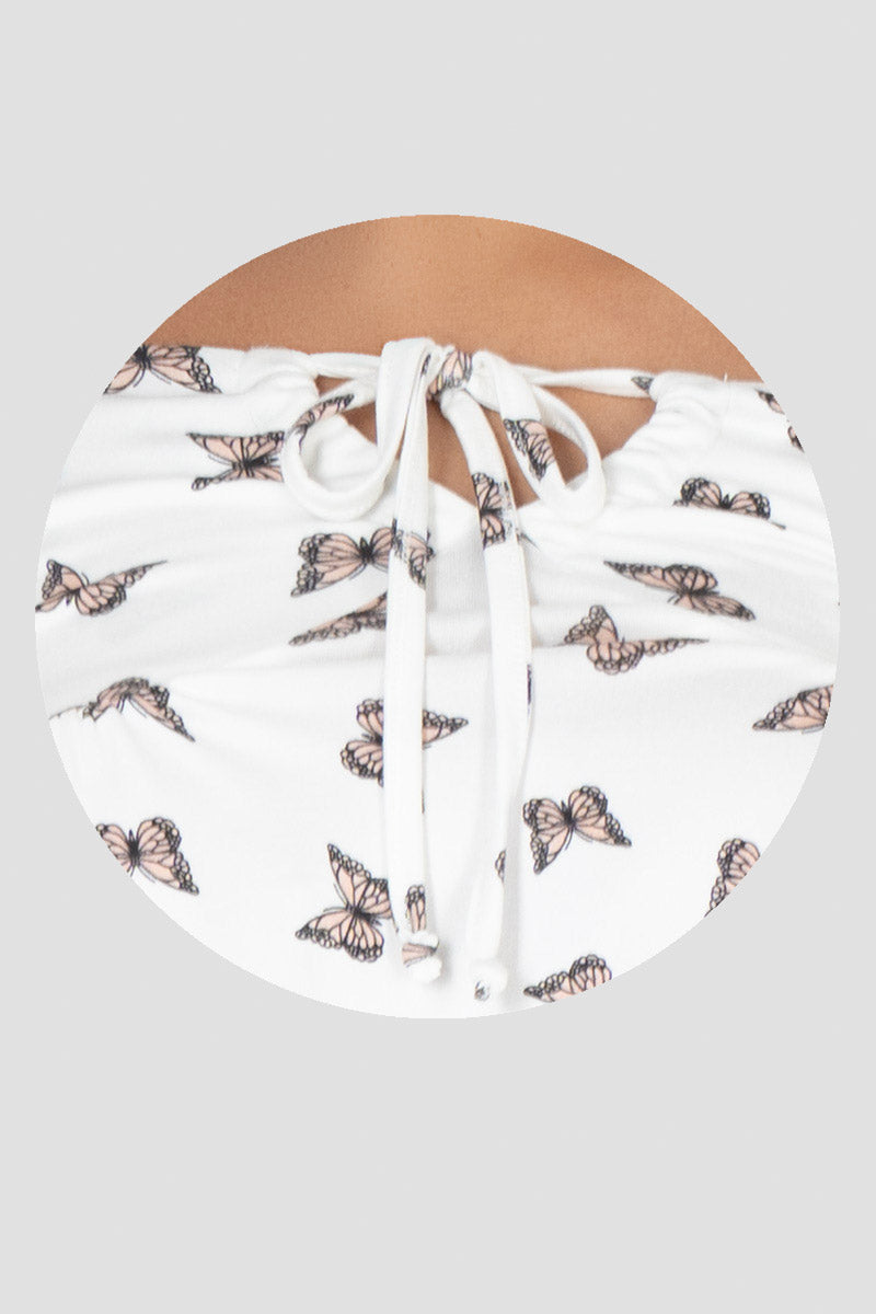 Blusa estampado de mariposas y olanes en manga