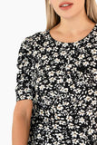 Blusa floral y mangas corta abullonadas
