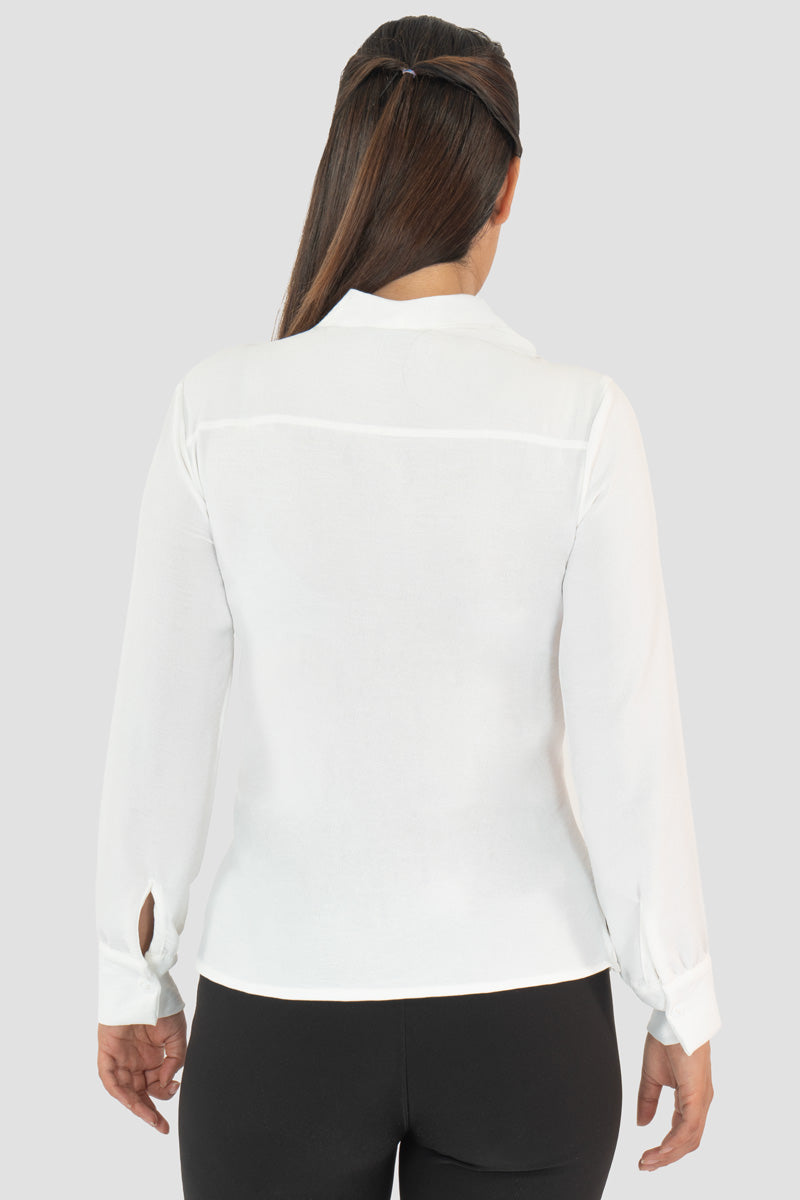 Blusa manga larga con moño en escote