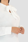 Blusa manga larga con moño en escote