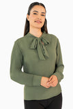 Blusa manga larga con moño en escote