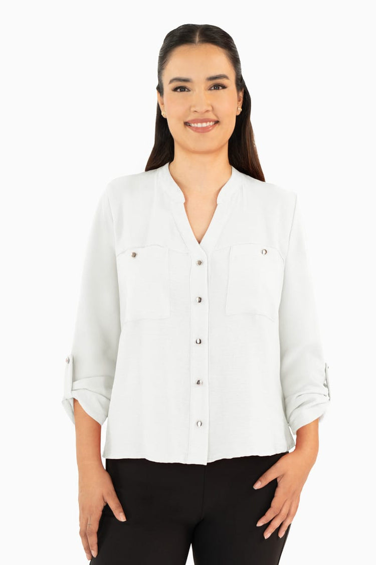 Blusa manga larga con bolsas y cuello mao