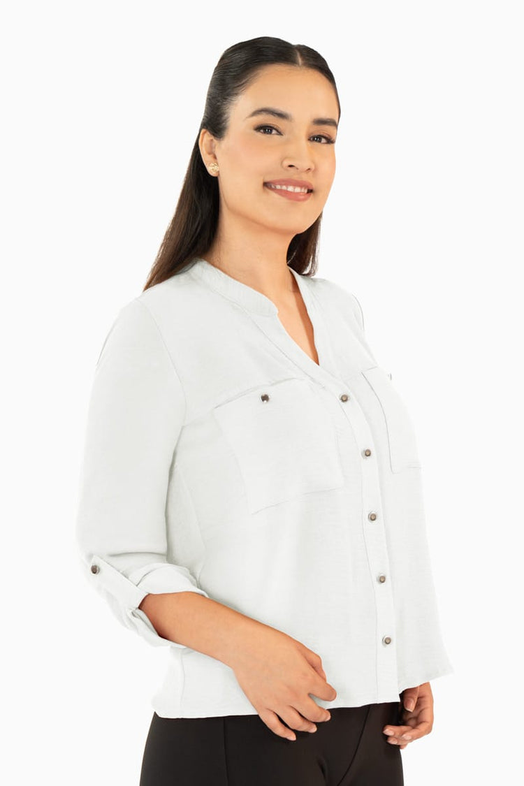 Blusa manga larga con bolsas y cuello mao