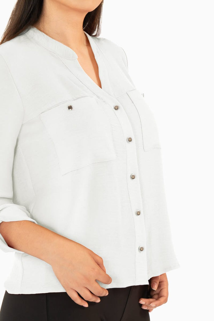 Blusa manga larga con bolsas y cuello mao