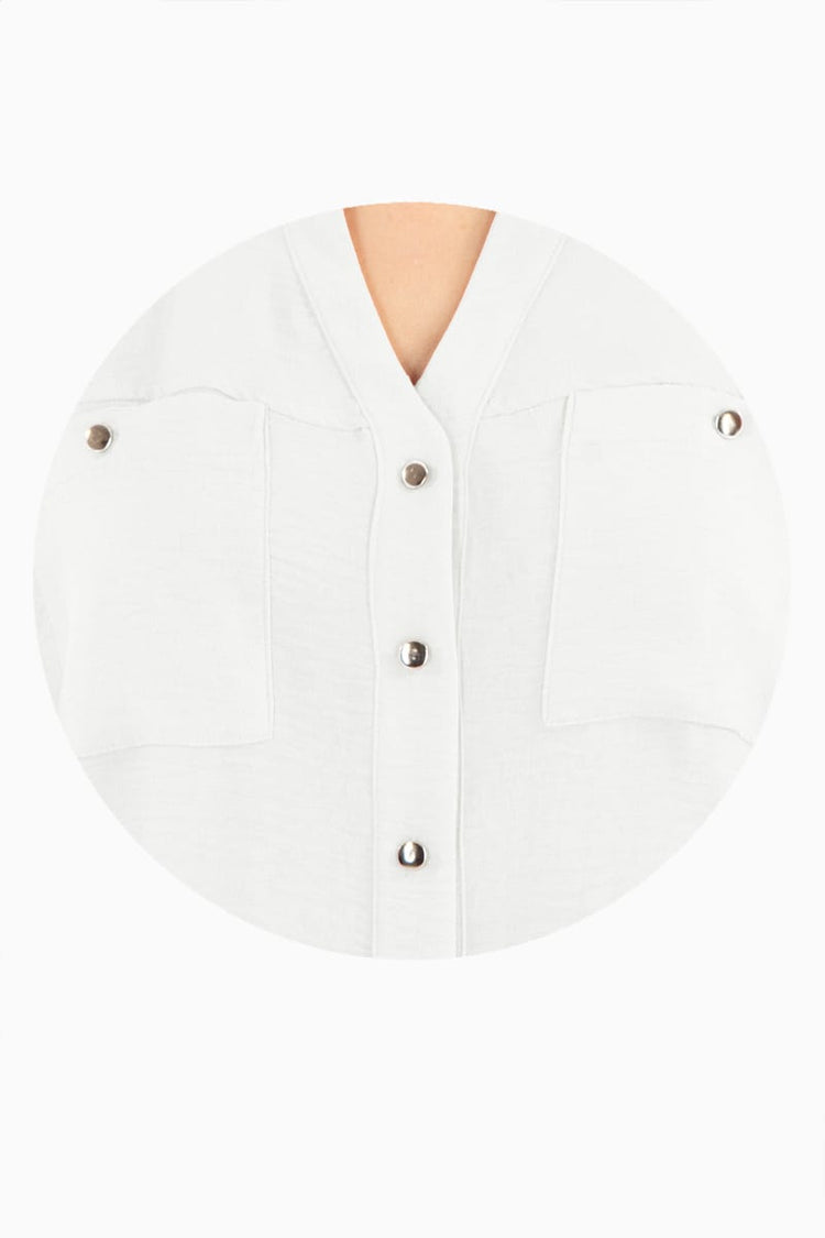 Blusa manga larga con bolsas y cuello mao