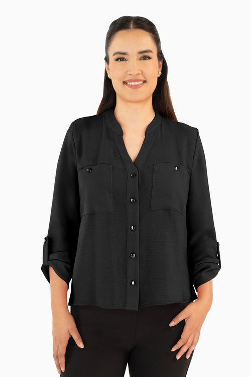 Blusa manga larga con bolsas y cuello mao