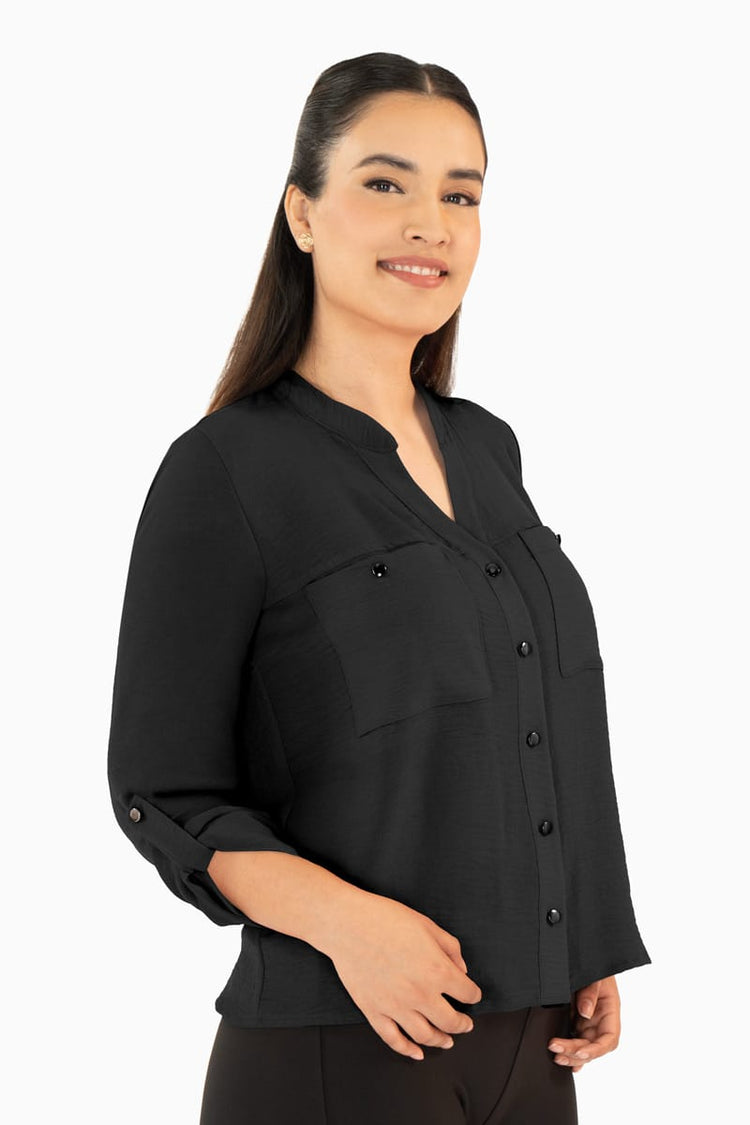 Blusa manga larga con bolsas y cuello mao