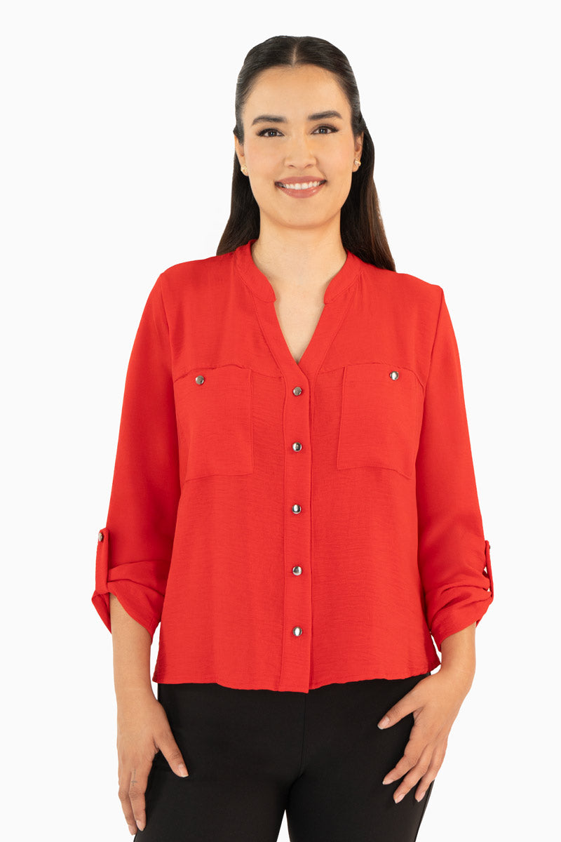 Blusa manga larga con bolsas y cuello mao