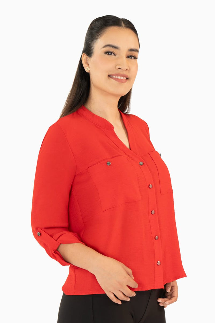 Blusa manga larga con bolsas y cuello mao