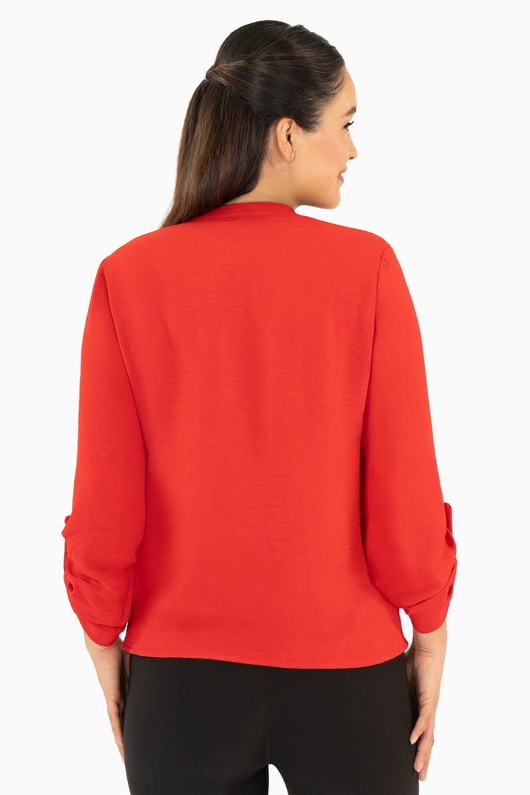 Blusa manga larga con bolsas y cuello mao