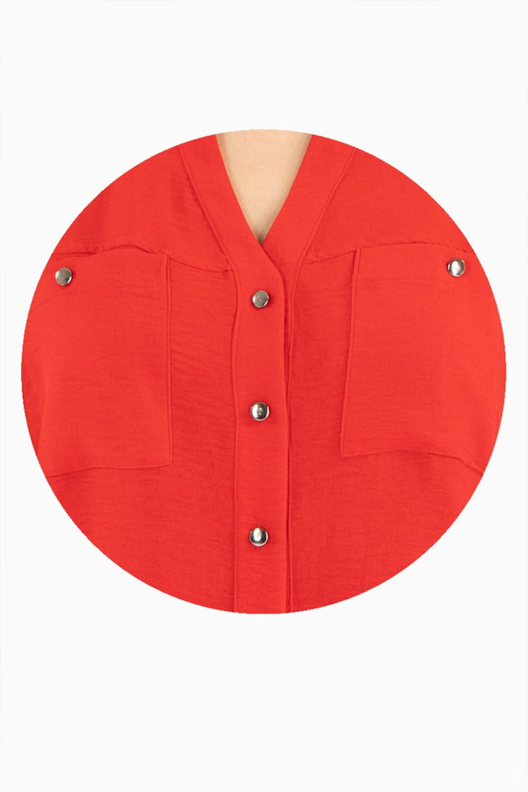 Blusa manga larga con bolsas y cuello mao