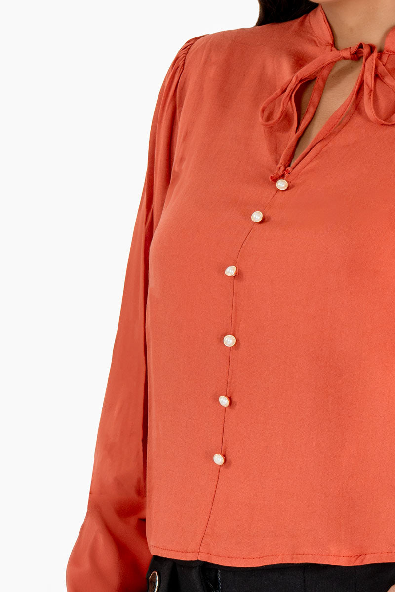 Blusa manga larga con botones y amarre