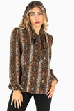 Blusa animal print manga larga y cinta en cuello