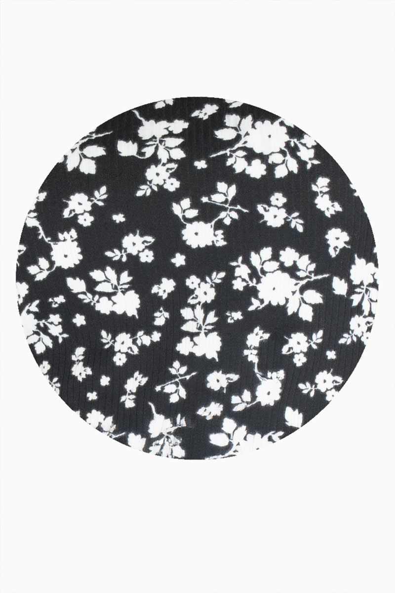 Blusa floral con amarre en mangas