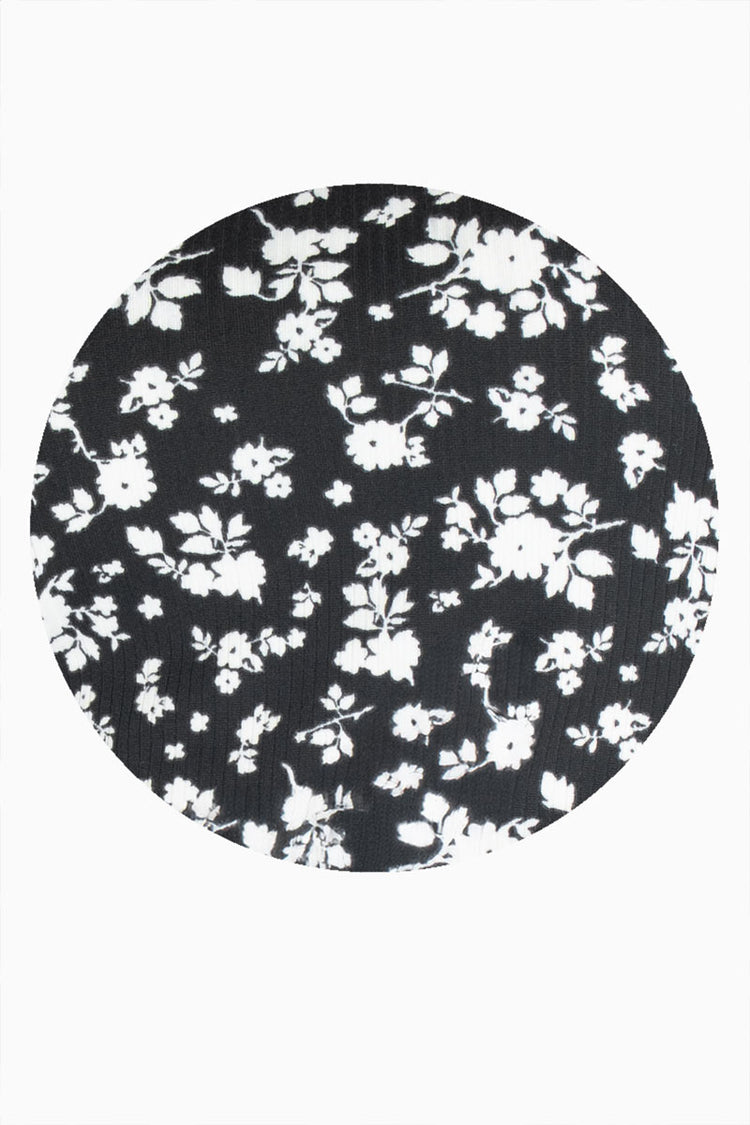 Blusa floral con amarre en mangas