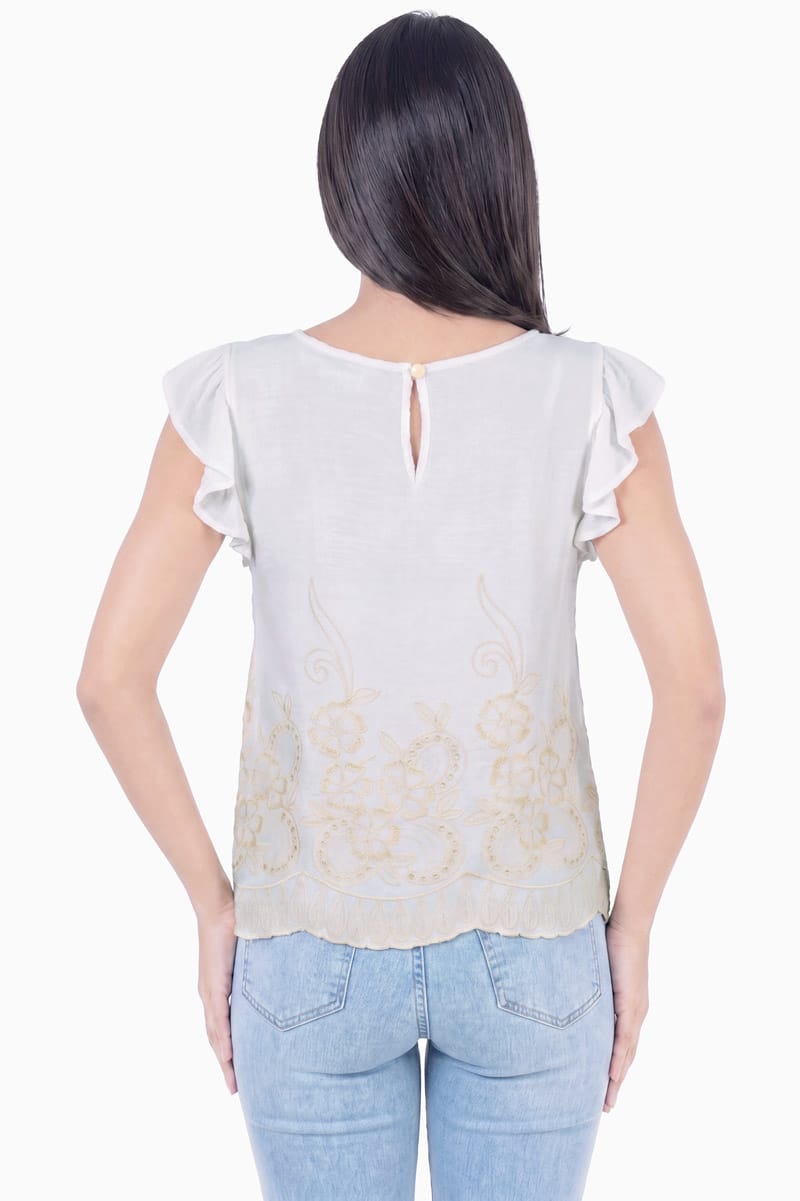 Blusa bordada con olán en manga