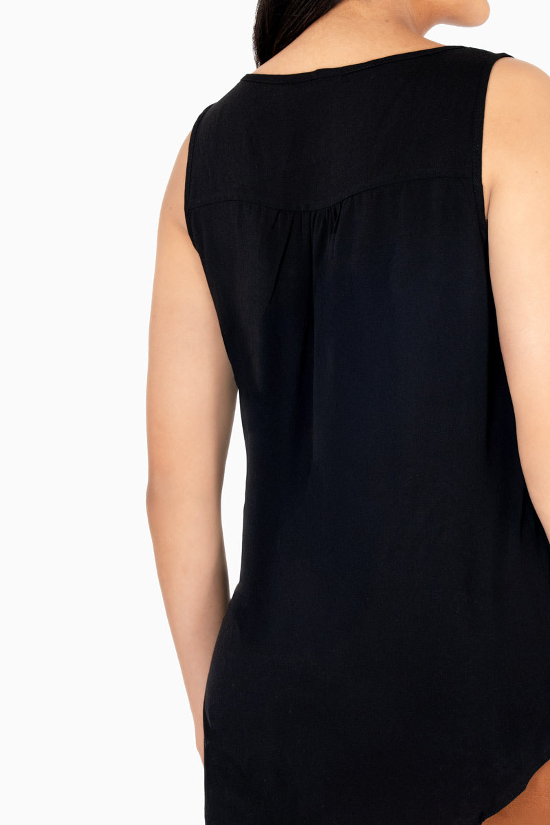 Blusa sin manga con botones y bolsa