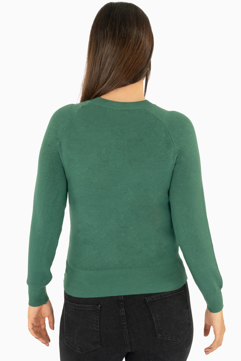 Suéter con detalle de piedras en hombros